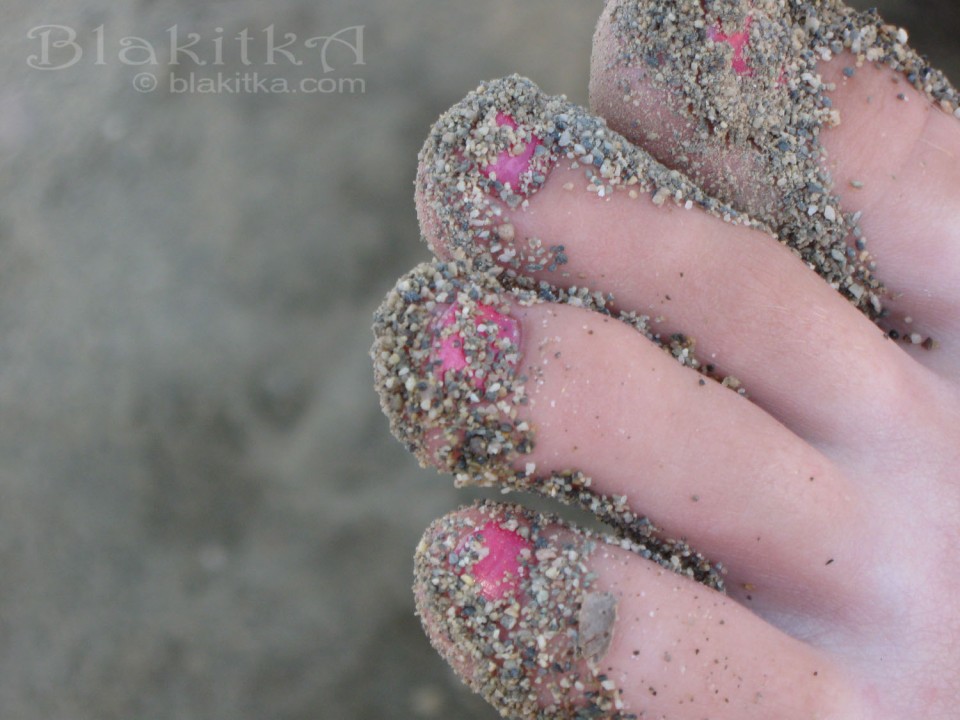 Pink toes in sand