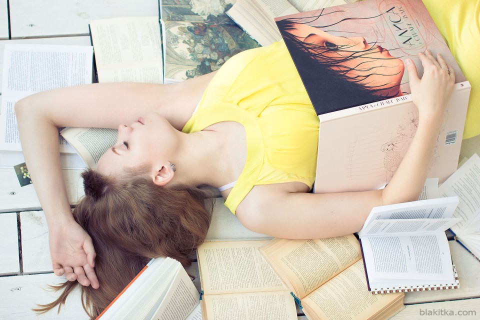 Girl in a yellow dress among books
